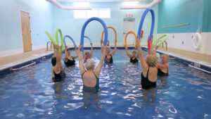 old ladies exercising in the pool