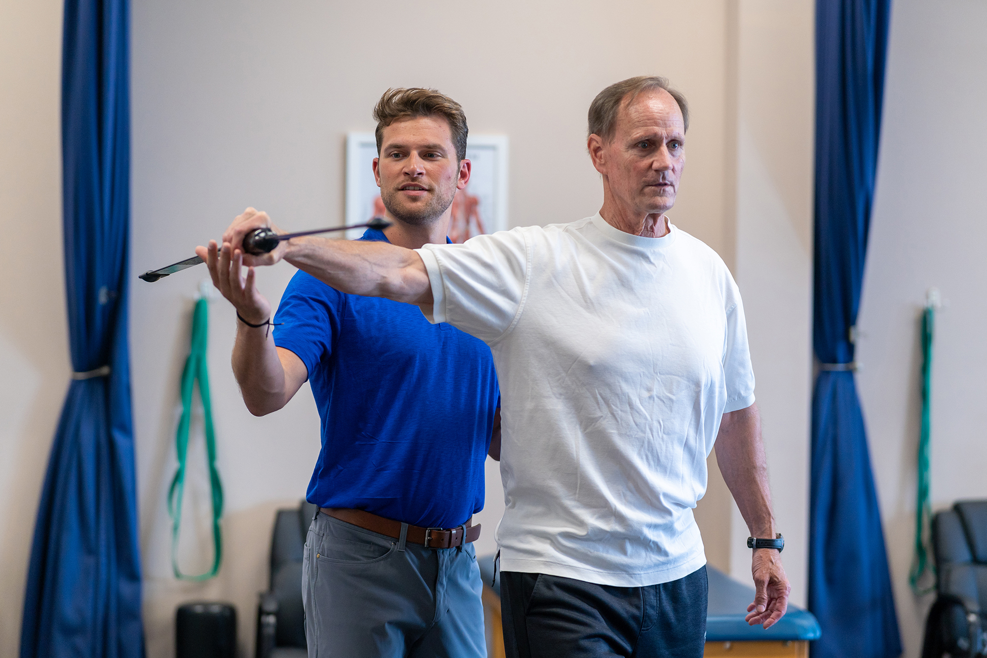Acqucare physical therapist working with a patient on shoulder mobility