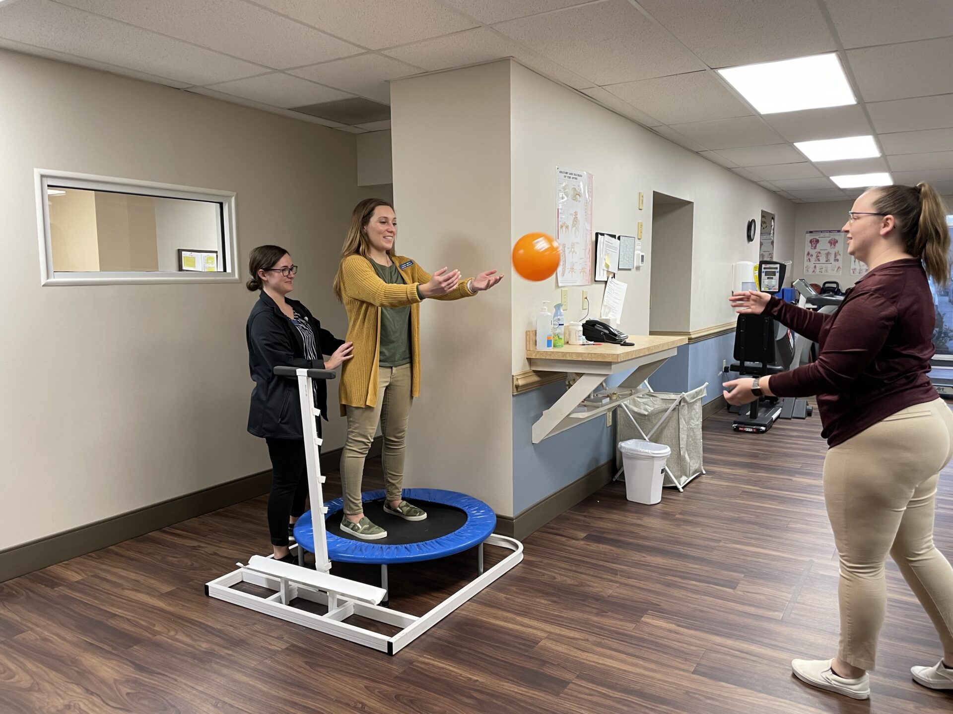 Physical Therapists working with a patient