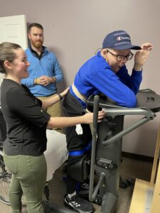 a man and woman working out on a stationary exercise bike