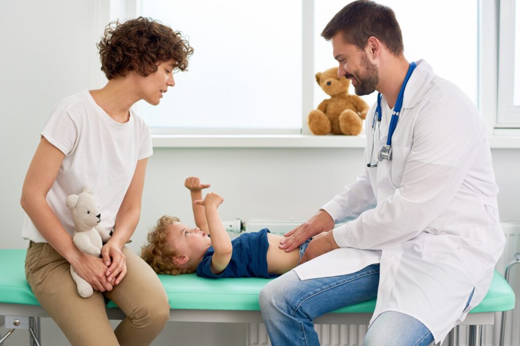 a young child being examined by a doctor