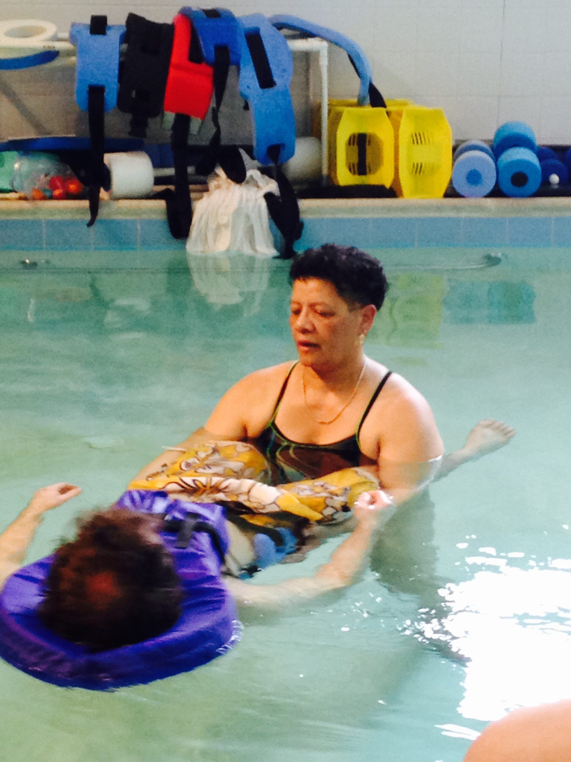Juanita in the pool with a patient