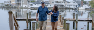 a man and a woman standing on a dock