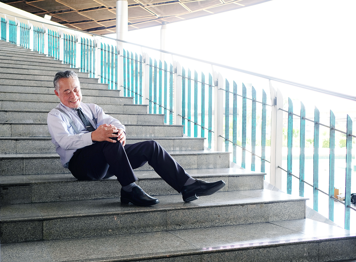a man sitting on a set of stairs